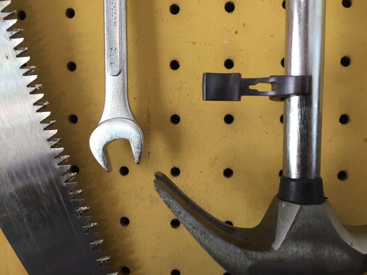 Throttle Opener magnetically stuck to a hammer handle in the garage